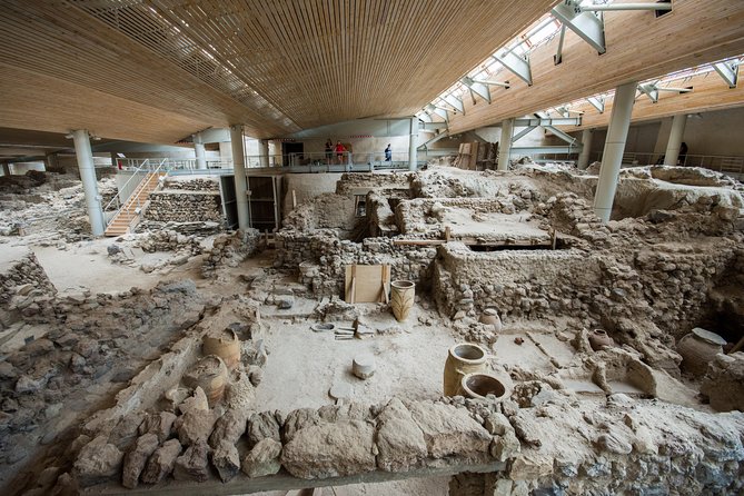 Archaeological Bus Tour To Akrotiri Excavations & Red Beach - Akrotiri Excavations: The Volcanic Ash Time Capsule