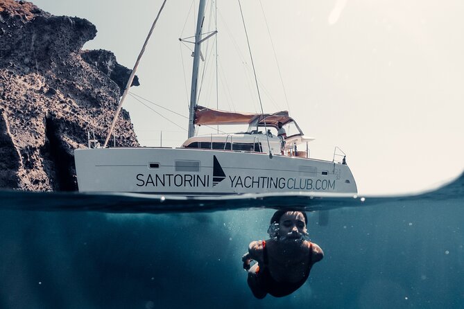 Beautiful Day Catamaran Caldera Cruise incl. Meal & Drinks - What you pay for: BBQ lunch, open bar, free snorkeling gear, transfers