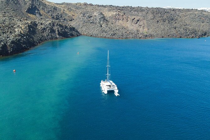 Best of Santorini Private Half-Day Catamaran Cruise with transfer and meal - Entering the Santorini catamaran day from Vlichada, not from a timetable