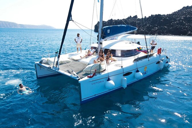 Best of Santorini Private Half-Day Catamaran Cruise with transfer and meal - Volcano photography, lighthouse angles, and the Black Rock moment