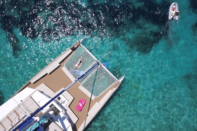 Blue Lagoon, Beaches and Bays Catamaran Sailing Tour - Boarding the Sea Breeze: Seats, Nets, and the Strict Clock
