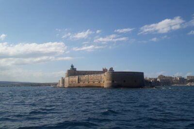 Boat Excursion to Ortigia with Typical Homemade Lunch - Sea caves on the north side: coral-flower colors and swim time