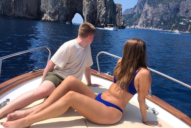 Boat Tour of the Caves on the Island of Capri - Marina Piccola Bay: Yachts, Hotels, and a Limoncello Break