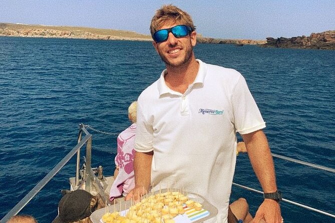 Boat trip through the coves of northern Menorca from Fornells - The onboard experience: slide, ladders, snorkeling gear, and comfort basics
