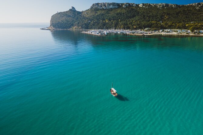 Cagliari : Gozzo Tour with 3 Swim Stops, Snorkeling & Local Food - Cala Bernat: Your First Real Swim Stop With White Sand Water