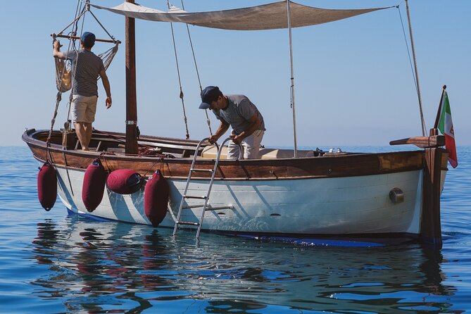 Cagliari : Gozzo Tour with 3 Swim Stops, Snorkeling & Local Food - Getting On at Molo Dogana: Meet-Up and What to Pack