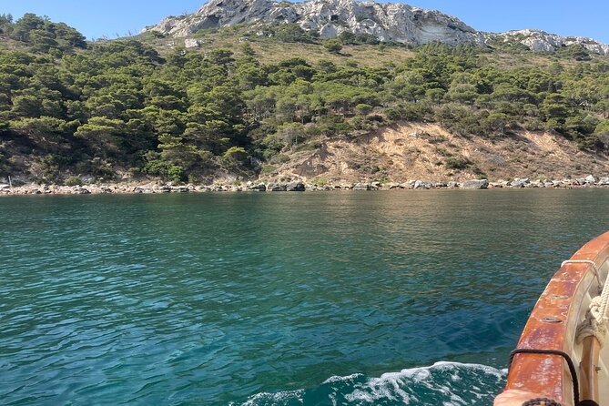 Cagliari Gulf Boat tour : 5 stops, snorkeling & local aperitif - Sella del Diavolo cliffs, stacks, and natural pools