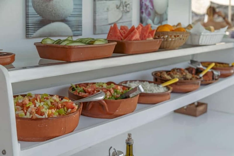 Cala Rajada: Boat Excursion with Drinks and Food - Swimming stops and snorkel gear: how to use the sea breaks well