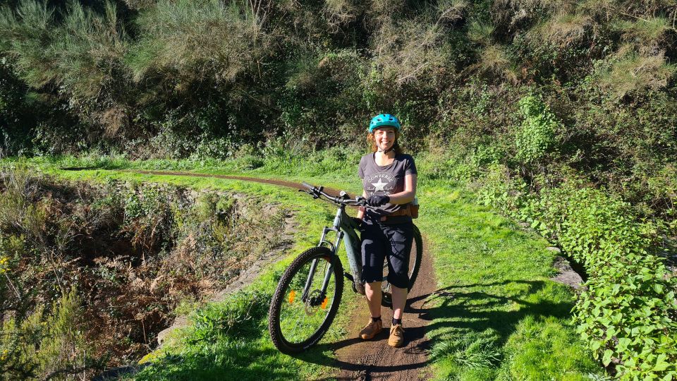Camacha: Levada Trail e-Bike Guided Tour - Following the levada channel: eucalyptus, old bridges, and that steady rhythm