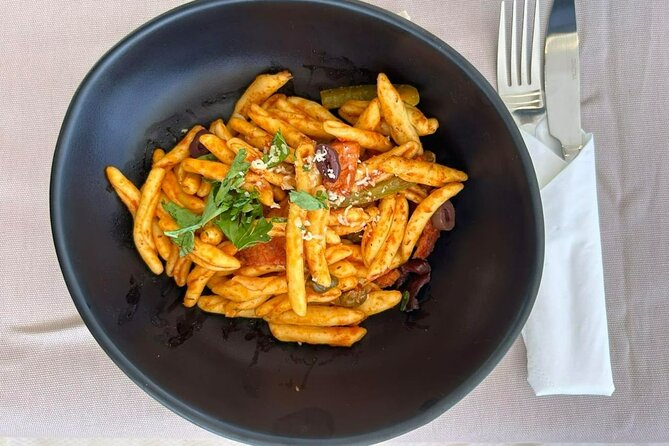 Catamaran Sailing to Dia with Lunch in Heraklion, Crete(EST 2024) - The lunch moment: traditional Cretan pasta, fruits, and drinks onboard