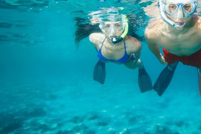 Chania Guided Snorkeling and Boat Excursion - Stop One and Stop Two: Fish, Remote Water, and a Cave Moment
