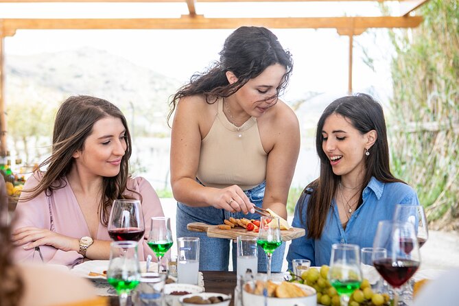 Citron Tasting and Distillery 1-Hour Guided Tour in Naxos - The distillery inside: family photos, small shop, and a possible bottle-your-own moment