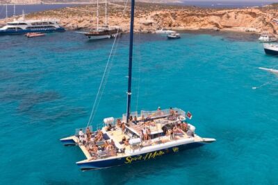 Comino Blue Lagoon Prime Catamaran Tour with All Inclusive - Stop 1 in Comino: bays, snorkeling time, and the Blue Lagoon gamble