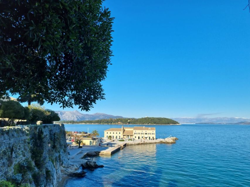 Corfu: Small Group City Walking Tour - Walking back toward Corfu-town with local food cues