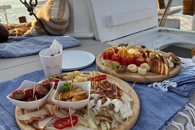 Corfu: Sunset Cruise on a Wooden Vessel with Cocktails & Bites - Garitsa Bay at golden hour: calm water, easy breathing room