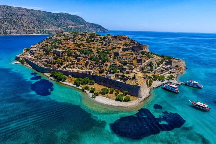 Crete: Spinalonga, Elounda, & Agios Nikolaos Boat Tour & BBQ - Getting there from Heraklion: bus pickups, timing, and sea crossing