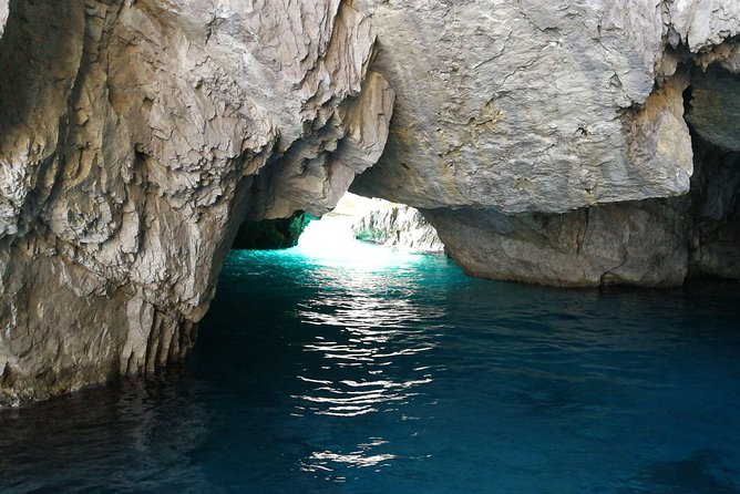 Discovery Capri Island by Boat from Capri - Green Grotto colors and the Punta Carena lighthouse from sea level