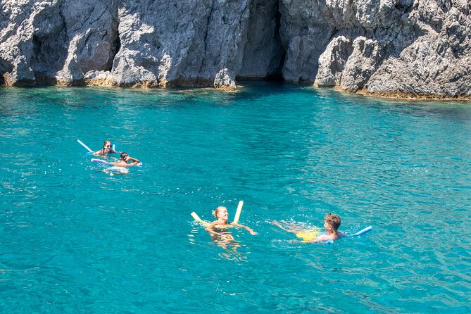 East Coast Bay to Bay Full-Day Boat Trip with Transfers - Traganou Bay near Afandou Caves: cave swimming for the bold
