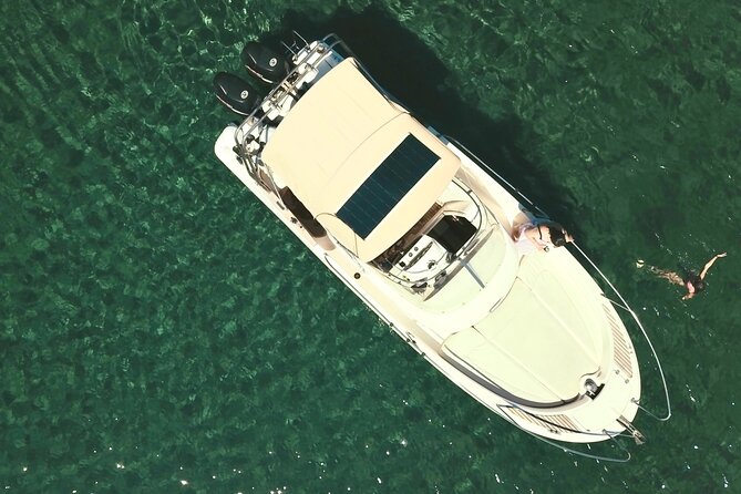 Explore Santorini and its volcanic wonders with Alex Private Boat - Nea Kameni: warm hot-spring swim near the volcano