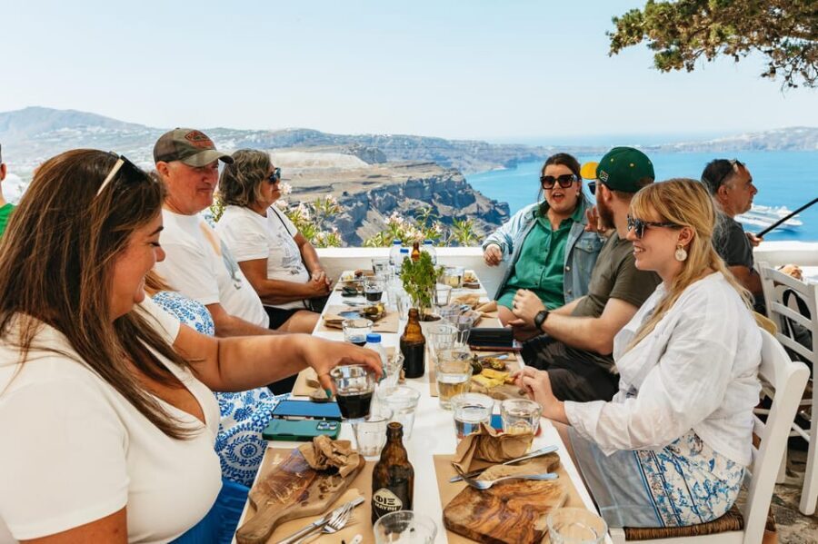 Fira: Guided Foodie Walking Tour with Tastings - The caldera-edge walk: volcano views, Aegean Sea air, and lane stories