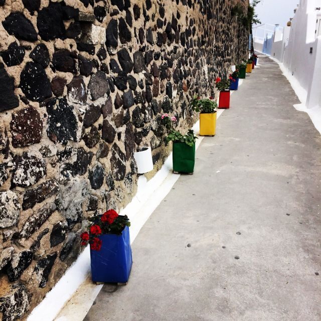Fira: Guided Foodie Walking Tour with Tastings - The daily market stop: fresh fish and vegetables that reset your expectations