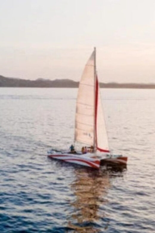 Fornells: Catamaran Sunset Cruise of Menorca's Coast - Onboard life: snacks, drinks, and space to breathe