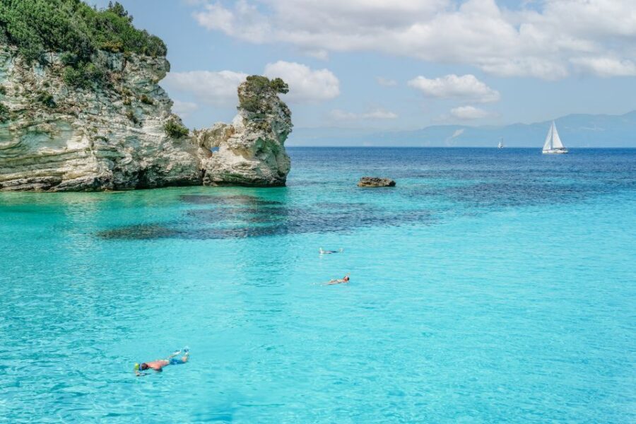 From Corfu Island: Antipaxos & Paxos Blue Caves Boat Cruise - Sailing back with a DJ and Greek dancing: the playful side of the cruise