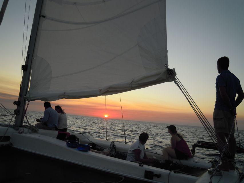 From Fornells: Half-Day Menorca Catamaran Trip w/ Snorkeling - On board vibe: quiet sailing, snacks, and a guide who works
