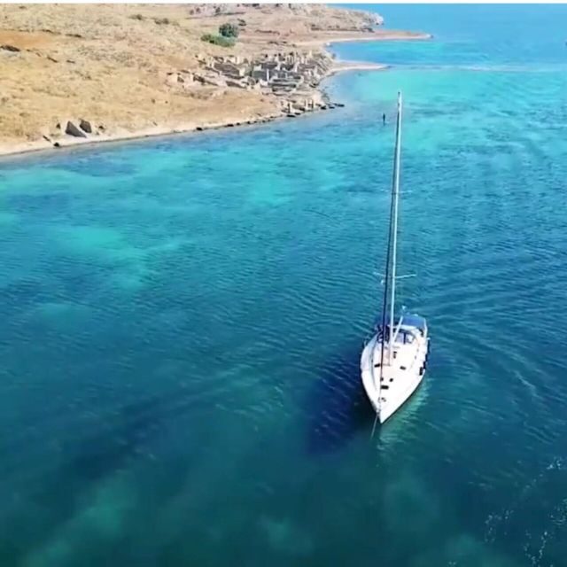 From Mykonos: Delos & Rhenia All-Inclusive Cruise with Lunch - Rhenia Island: snorkeling and standup paddleboarding in crystal-clear water