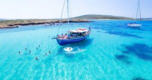 From Paros: Antiparos and Despotiko Full-Day Swim Cruise - Getting on board at Paroikia Port (Meraki or Maria) and how the 7 hours are paced