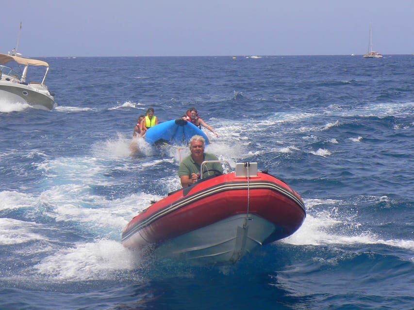 From Puerto Rico: Boat trip along the coast w/ Food & Drinks - Banana Boat Fun and Optional Add-Ons on Board