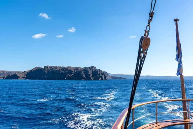 From Santorini: Volcano Cruise With Oia Sunset - Athinios Port Morning: the day starts with buses and live commentary