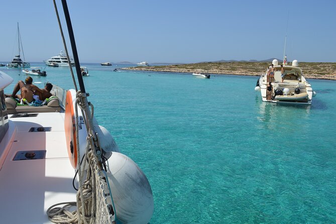 Full Day Catamaran Cruise in Paros - Stop 5 Antiparos Simadoura: rocky coast, small caves, and big photo moments