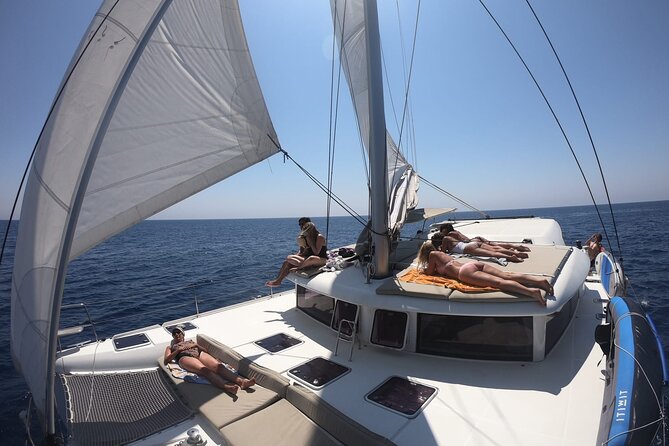 Full day catamaran tour in Alghero - Porto Conte Anchor Time: The Longest Swim and Lunch Moment
