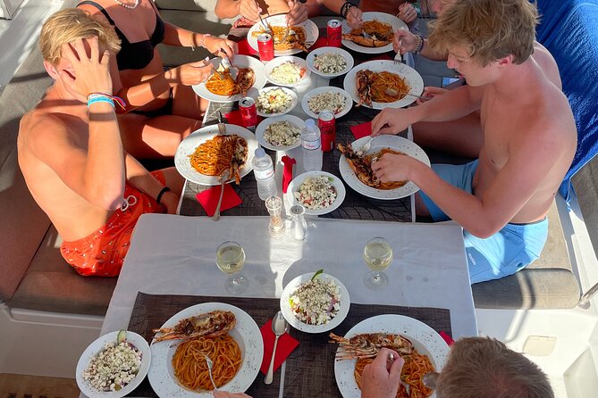 Full Day Discovering Mykonos Delos Renia Tour by Boat - Food and drinks: lobster pasta lunch plus Greek snack stops