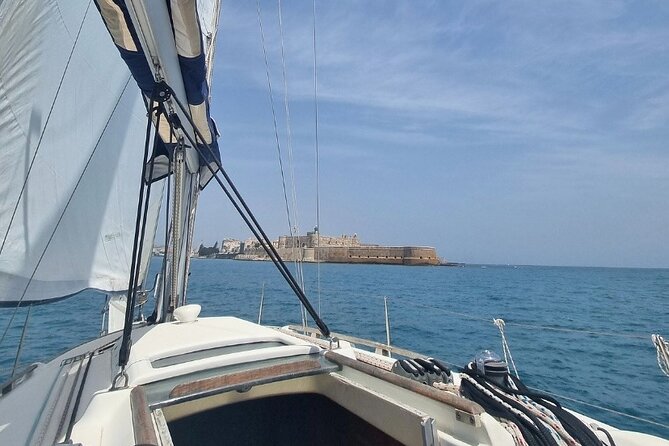 Full Day Sailing Tour Catania-Acitrezza - Lunch, wine, and the pace back on board