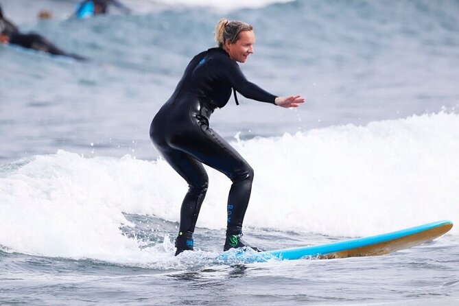 Group Surf Class in Playa de Las Américas with Photographs - Warm-up and wetsuit prep: small comfort, big impact