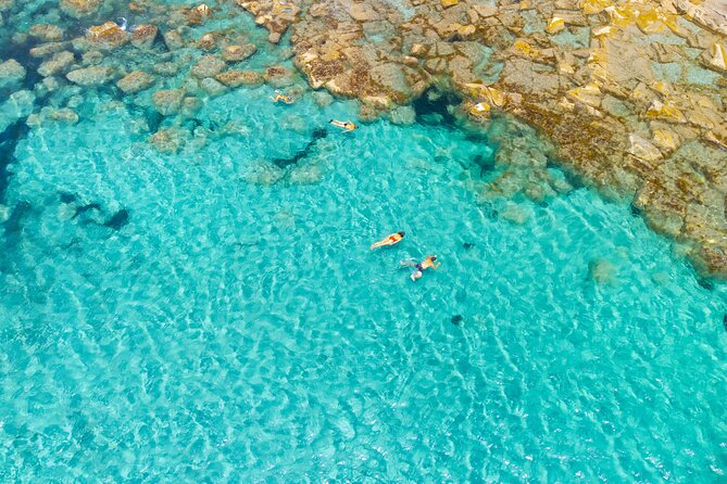 Guided day by boat in Carloforte with snorkelling and aperitif - Punta Delle Colonne: Quick Photo Stop for a Sea-Stack Classic