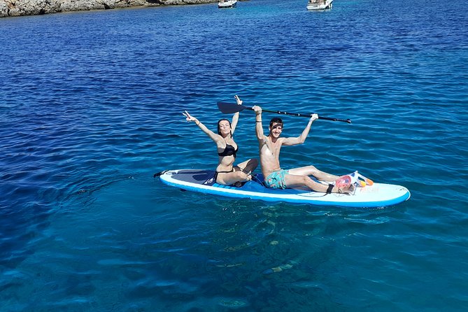 Half-Day Catamaran Trip in Menorca - Language, personality, and onboard vibe