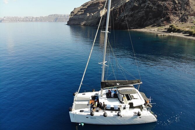 Half-Day Exclusive Catamaran Cruise in Santorini with Meal and Open Bar - Red Beach stop plus Venetian Lighthouse pass-by