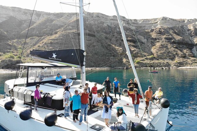 Half-Day Exclusive Catamaran Cruise in Santorini with Meal and Open Bar - What the open bar and onboard vibe actually feel like