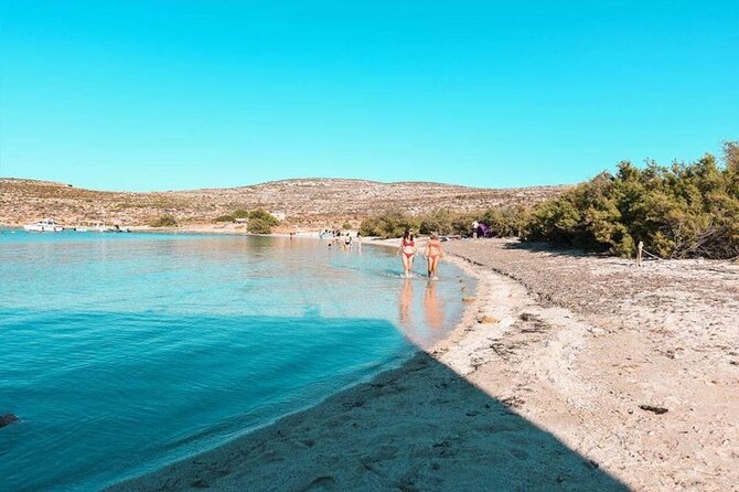 Half Day Malta Tour to Gozo Comino and Blue Lagoon Caves - Gozo Harbour and the coastal glide past San Niklaw Bay