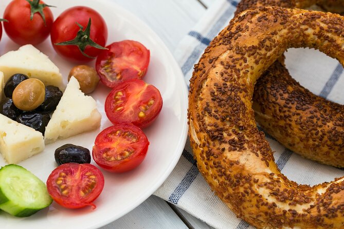 Heraklion Food Stories Walking Tour with 8 local-favorite stops - Venetian Harbor Bites: Organic Meat, Fried Snails, and Cretan Wine
