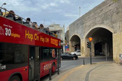 Hop-On Hop-Off Sightseeing Bus Tour in Heraklion - Entering the bus system: mobile ticket, earphones, and audio