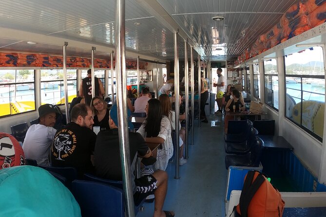 Ibiza: Es Vedrà Catamaran Cruise – Morning or Sunset - Onboard experience: free drinks, a slide, and a sunset party mood