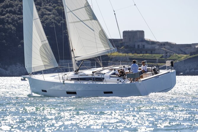 Ibiza Midday or Sunset Sailing with Light Snacks and Open Bar - Cala and cliff spotting: Illa Sa Conillera and beyond