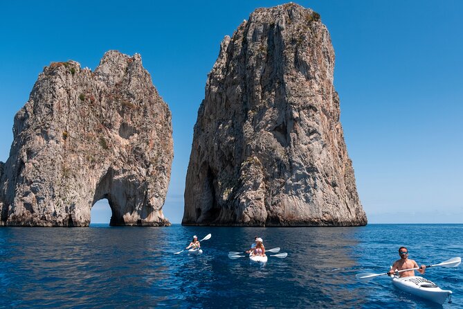 Kayak tour in Capri between caves and beaches. Photos included. - Arco della Stella and the Faraglioni Photo Moment