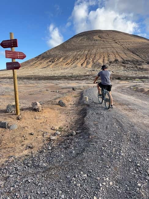 La Graciosa: Rent your ELECTRIC BIKE and explore the island at your own pace. - What to bring: clothes, water, and the no-restaurants reality