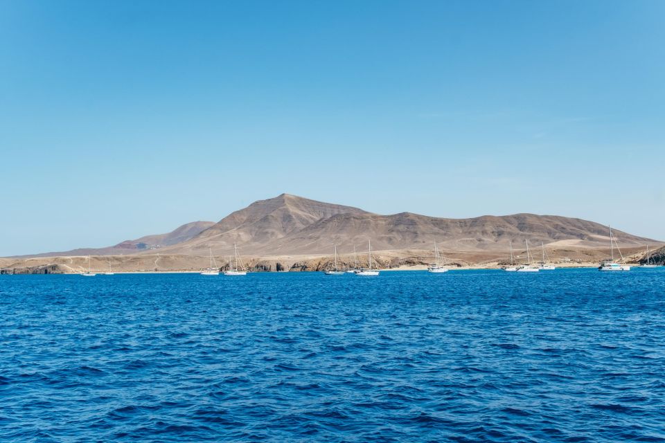 Lanzarote: Day Trip to the Papagayo Beaches by Catamaran - Boarding the Líneas Romero Catamaran: Mojito, Omelette Tapas, and Crew Energy