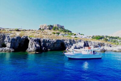 Lindos, Pefkos:Summer Breeze 3 Hour All Inclusive Swimming Cruise - Lindos Caves swim stop: rock-face snorkeling and cave entry time